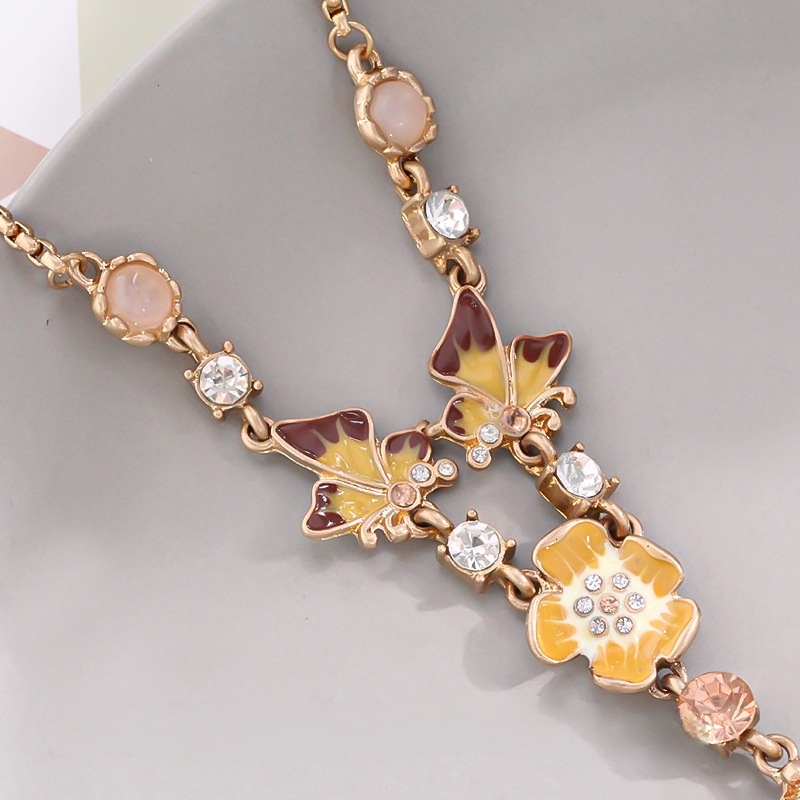 Enamel Butterfly and Floral Necklace – Artistic Monet-Inspired Design with Enamel and Crystal Accents