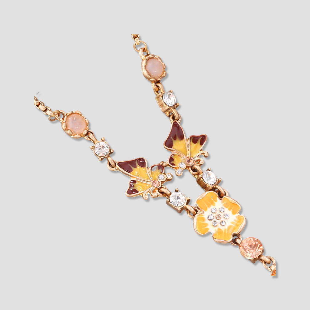 Enamel Butterfly and Floral Necklace – Artistic Monet-Inspired Design with Enamel and Crystal Accents