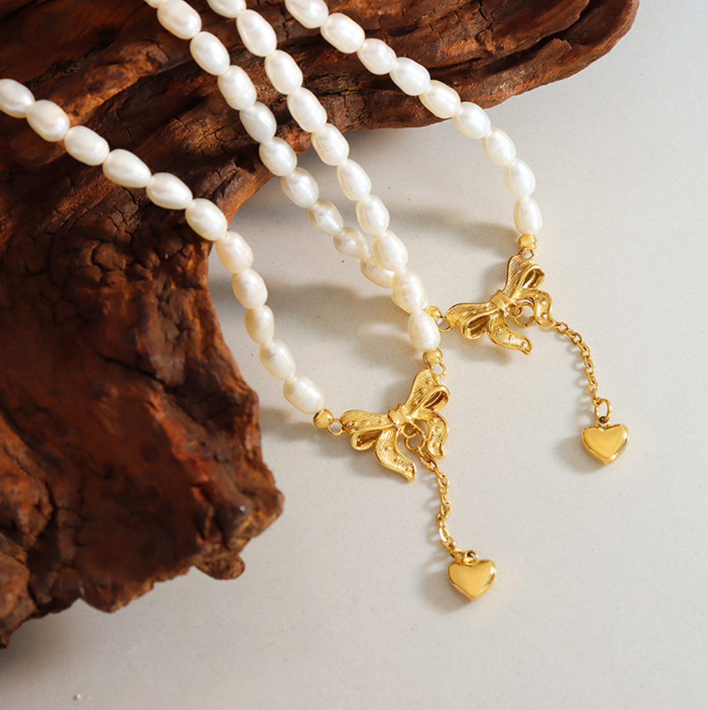 Hopeful Ribbon – Freshwater Pearl Necklace with Heartfall Accent